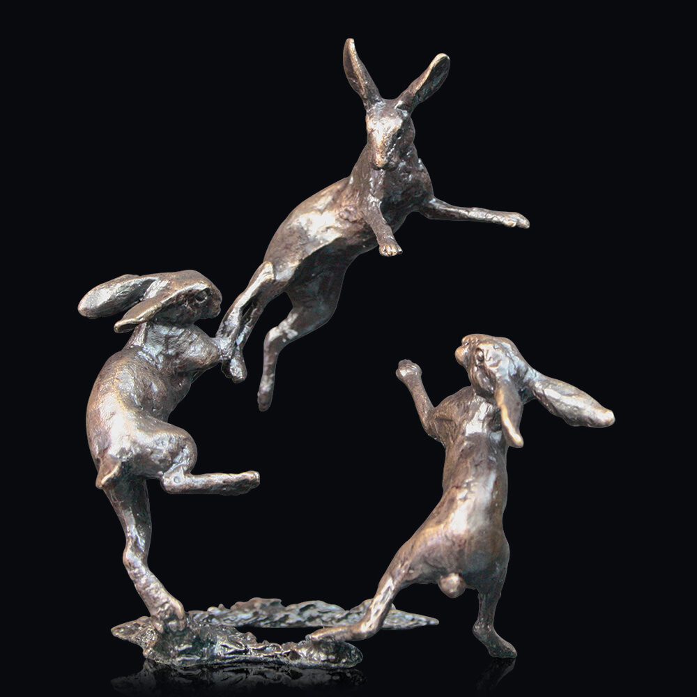 Three dancing hares